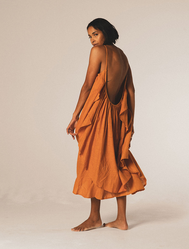 A Perfect Nomad sustainable natural summer fashion Grace dress is ochre orange