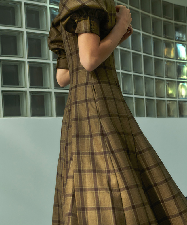 olistic_the_label_carlina_dress_upcycled_wool_brown_model_turning_photograph