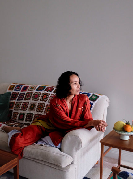 johanna-detox-life-slow-living-editorial-scroll-image-johanna-sitting-on-sofa-wearing-red-robe