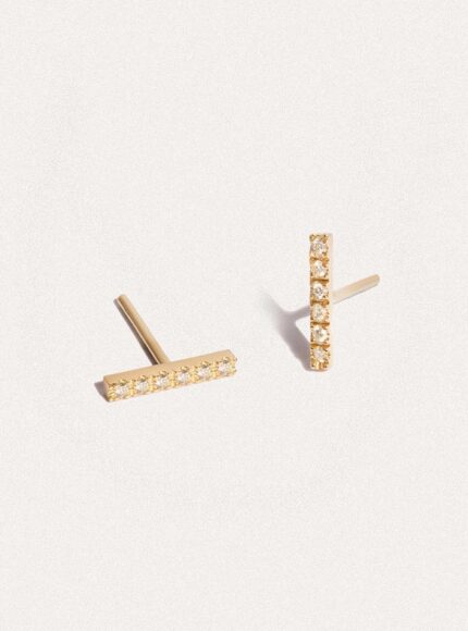 A pair of gold and diamond stud earrings