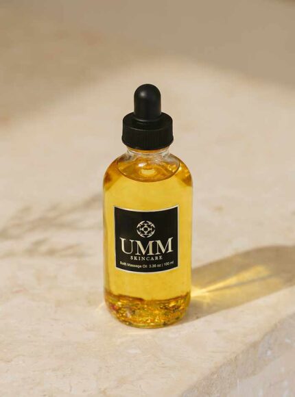 UMM Ayurvedic body massage oil product image on a marble top background