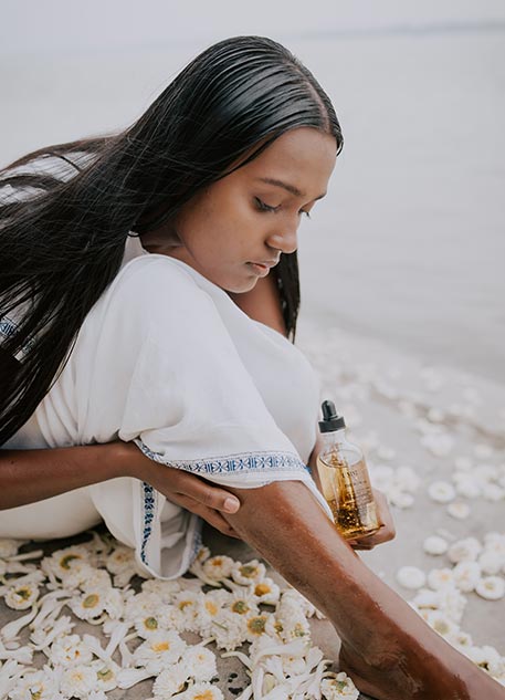 Model exploring the meaning of Ayurveda besides a river