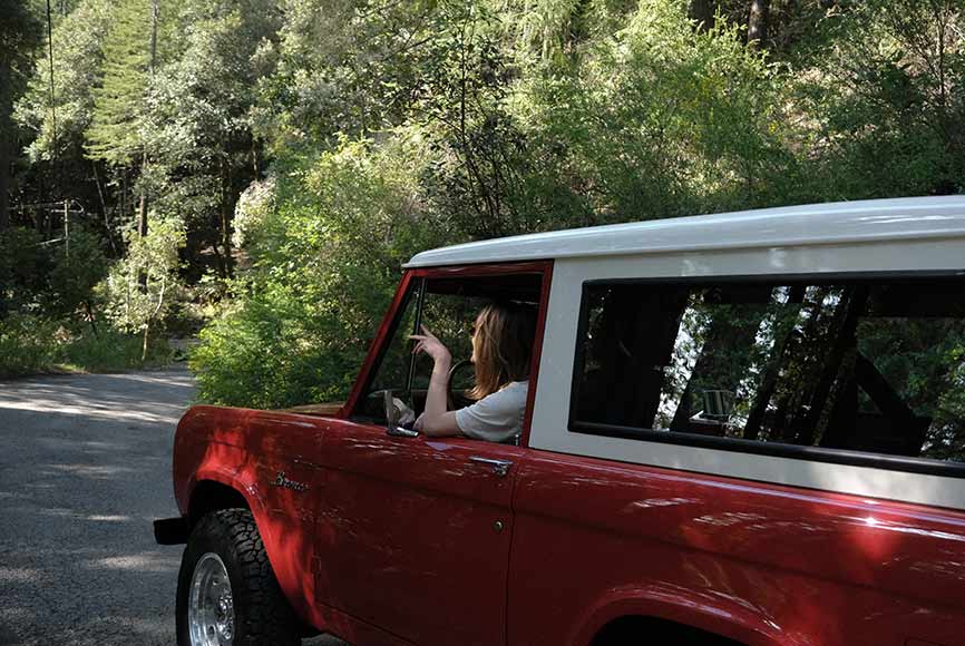A fully restored retro bronco on a California road trip