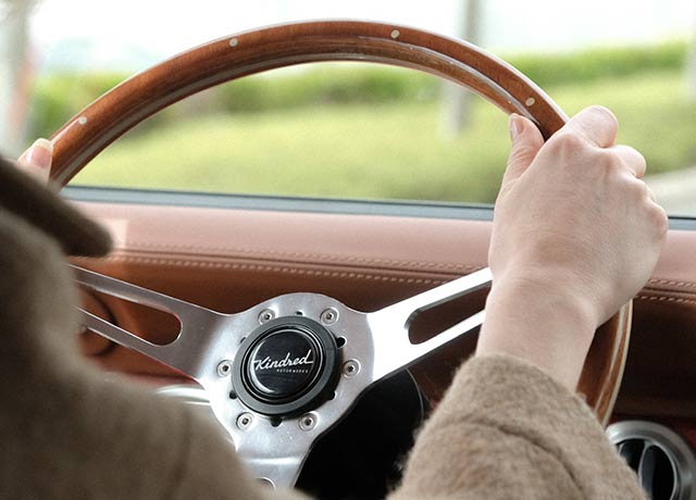 Close up of a newly restored vintage car's steering wheel