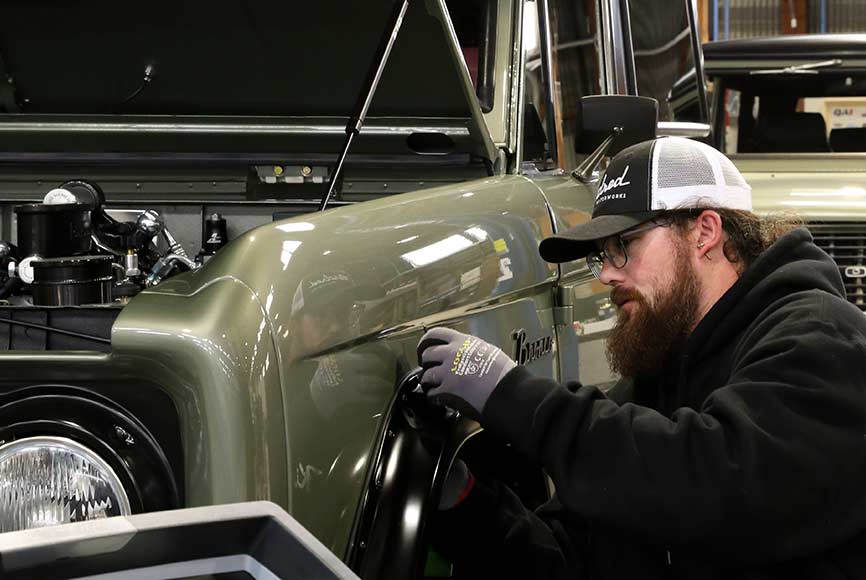 A Kindred worker at their factory in California. Every one of their electric car conversions are made in America.