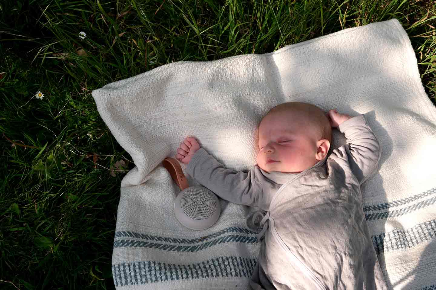 Baby relaxing in an ergoPouch sleep sack
