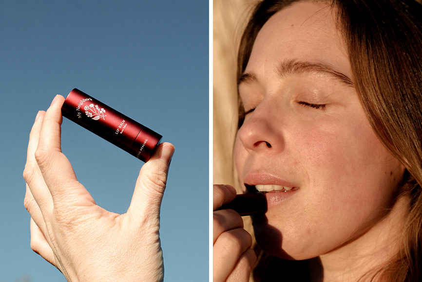 A woman putting on tallow lip balm