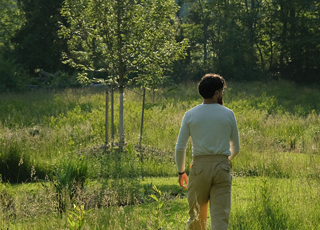 Gaz Oakley in a field with trees