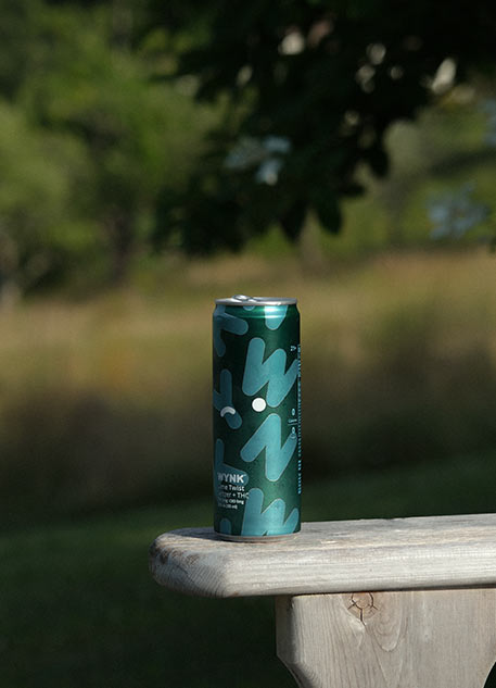 WYNK can on an Adirondack chair in Maine