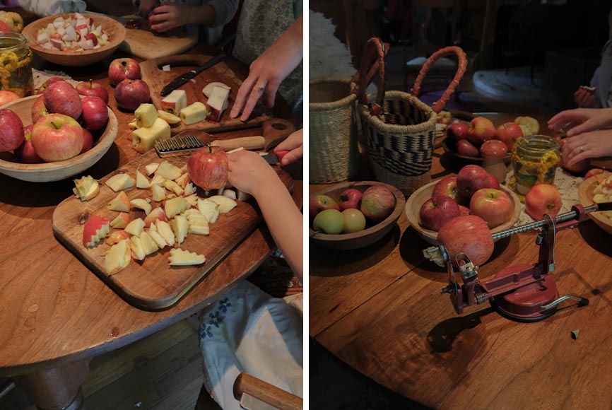A family cutting apples at a wooden table