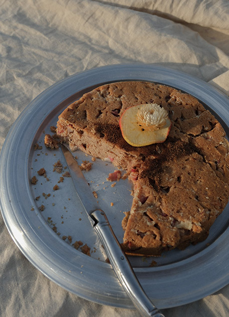 Apple cake on a silver platter with a linen tablecloth