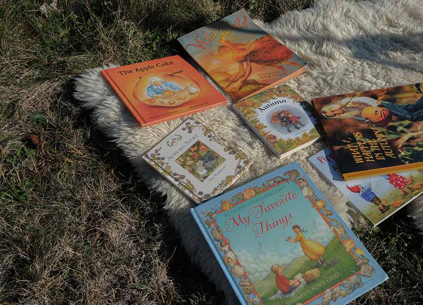 Children's books on a sheepskin rug
