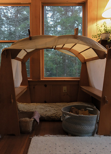 A children's fort set up in a living room