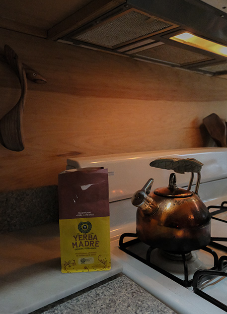 A bag of Yerba Madre tea in a kitchen next to a kettle