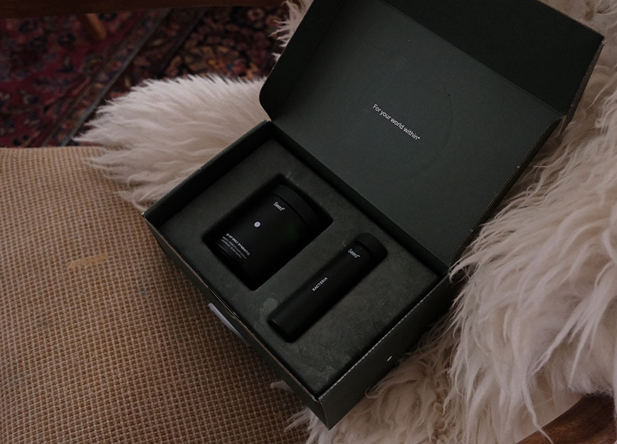 A box of seed probiotics on a sheepskin chair