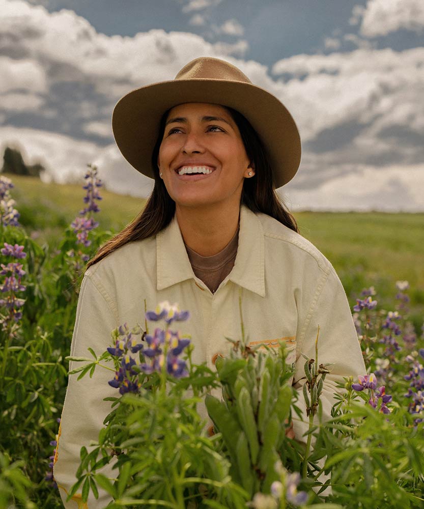 Simpli founder Sarela Herrada in a meadow in Peru