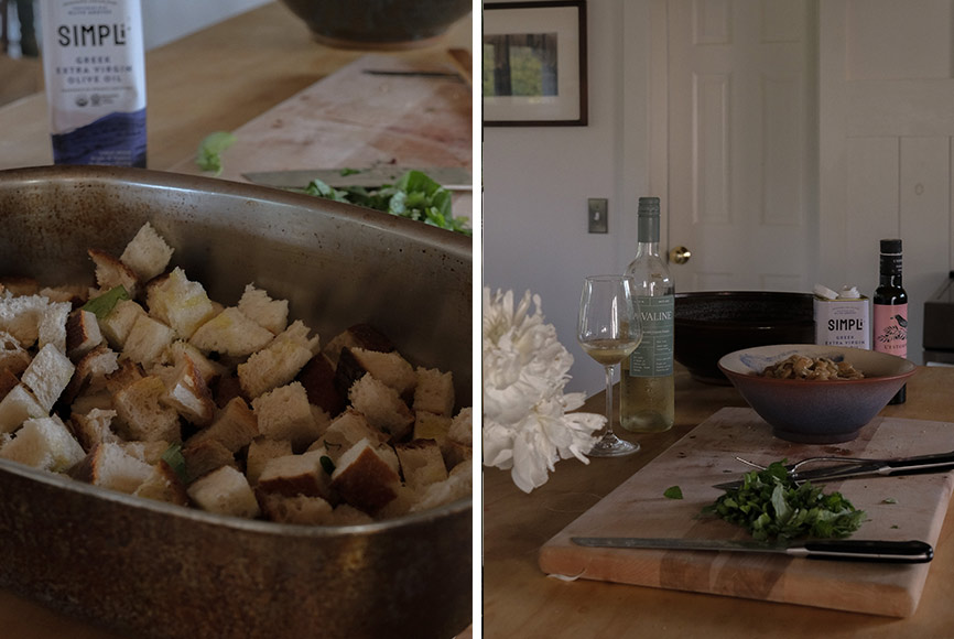 Cut up bread being made into a panzanella salad