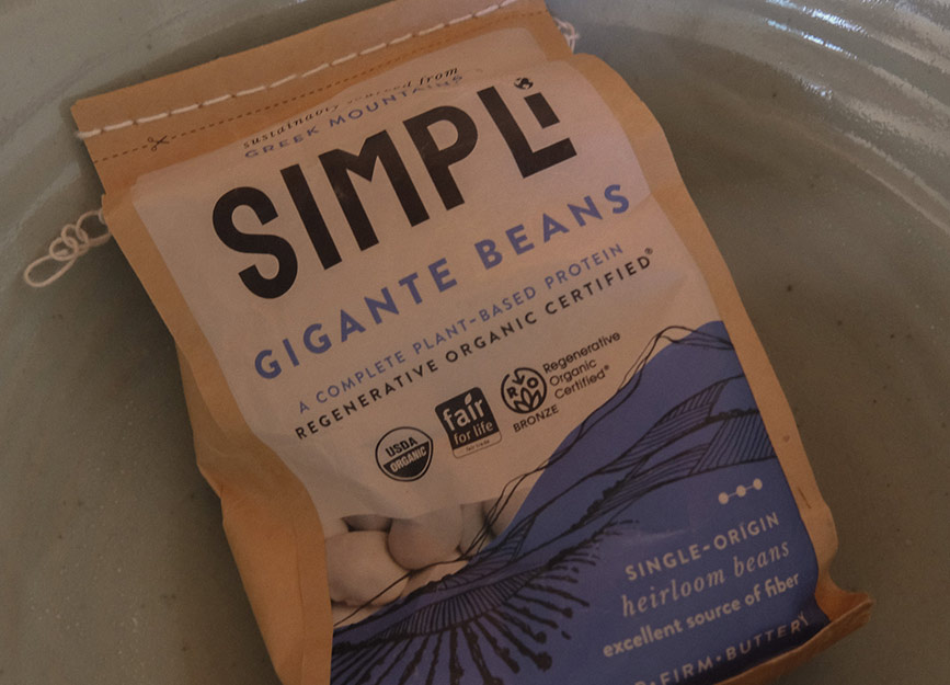 A bag of SIMPLi Gigante Beans in a bowl